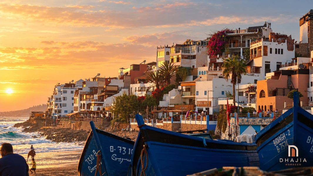 Blue fishing boats beside Taghazout waterfront near Agadir in warm evening light