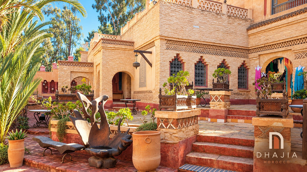 Stone courtyard, palms, carved details and sculptural seating at the Medina of Agadir; edited destination photograph.