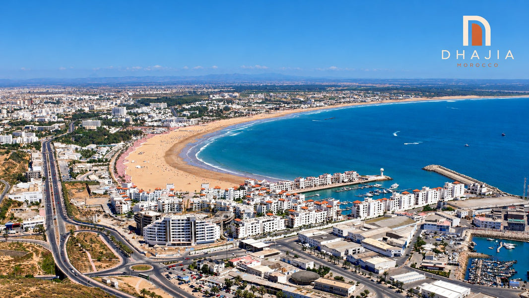 Agadir Marina, white waterfront apartments and the crescent beach viewed from the Oufella hillside; colour-edited photograph.