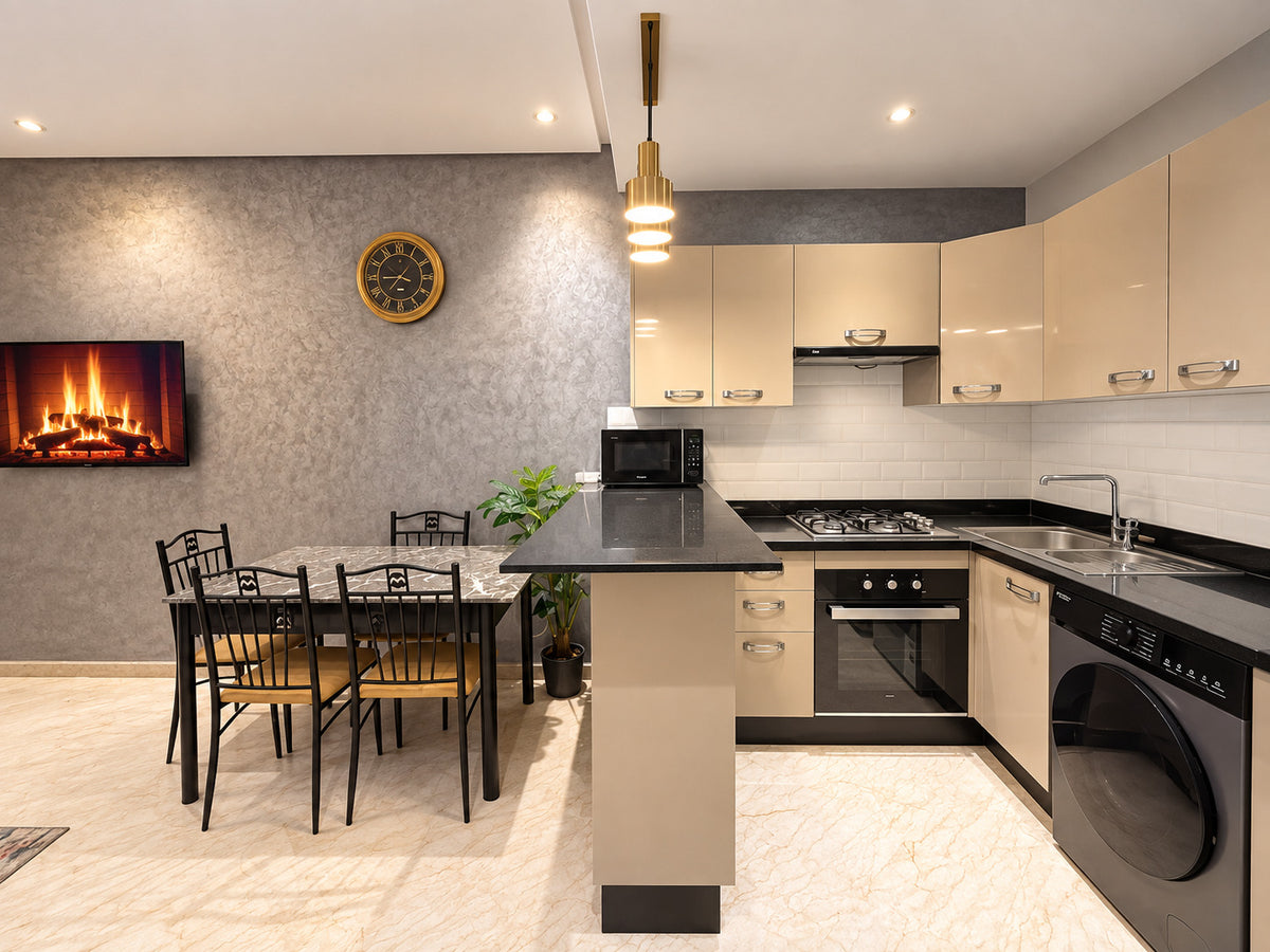 DHAJIA Morocco Hivernage Agadir Bay apartment kitchen dining area and smart TV fireplace
