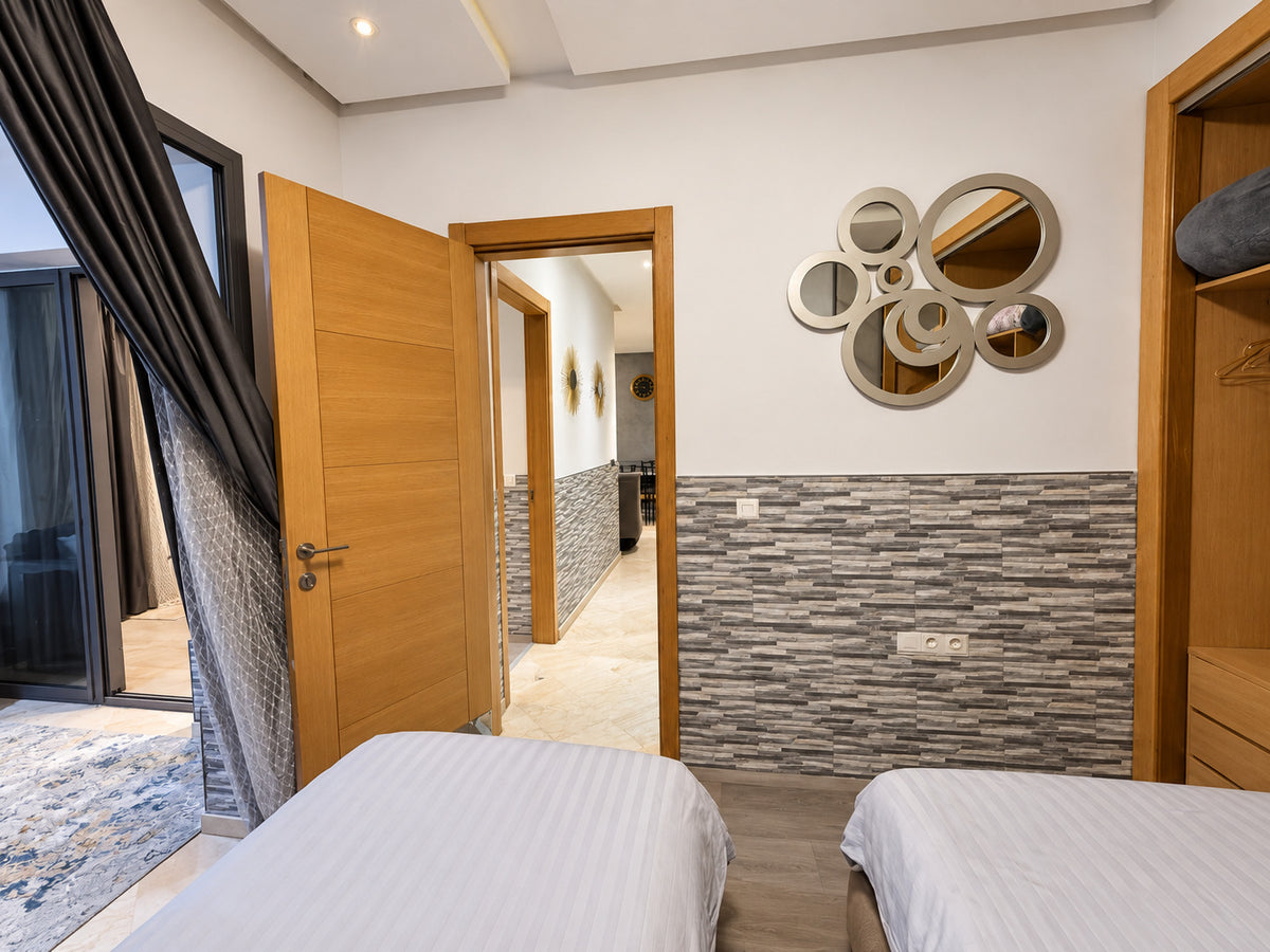 DHAJIA Morocco Hivernage Agadir Bay apartment twin bedroom and hallway view
