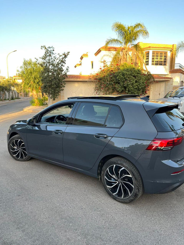 Grey Volkswagen Golf 8 available for DHAJIA Morocco car hire in Agadir — rear and side view
