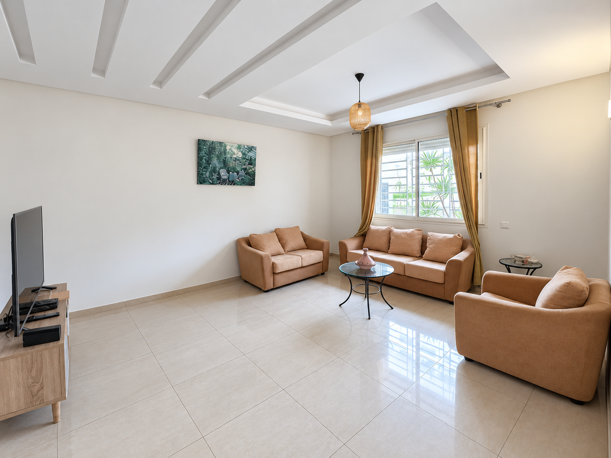 Living room with sofas beside windows — 2-Bed Apartment with Parking for Sale, Hay Mohammadi, Agadir | DHAJIA Morocco