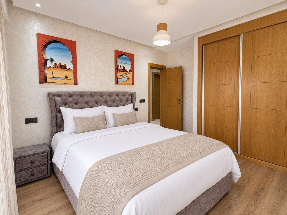 Bedrooms | Main bedroom with hospitality-grade white bedding and fitted wardrobes
