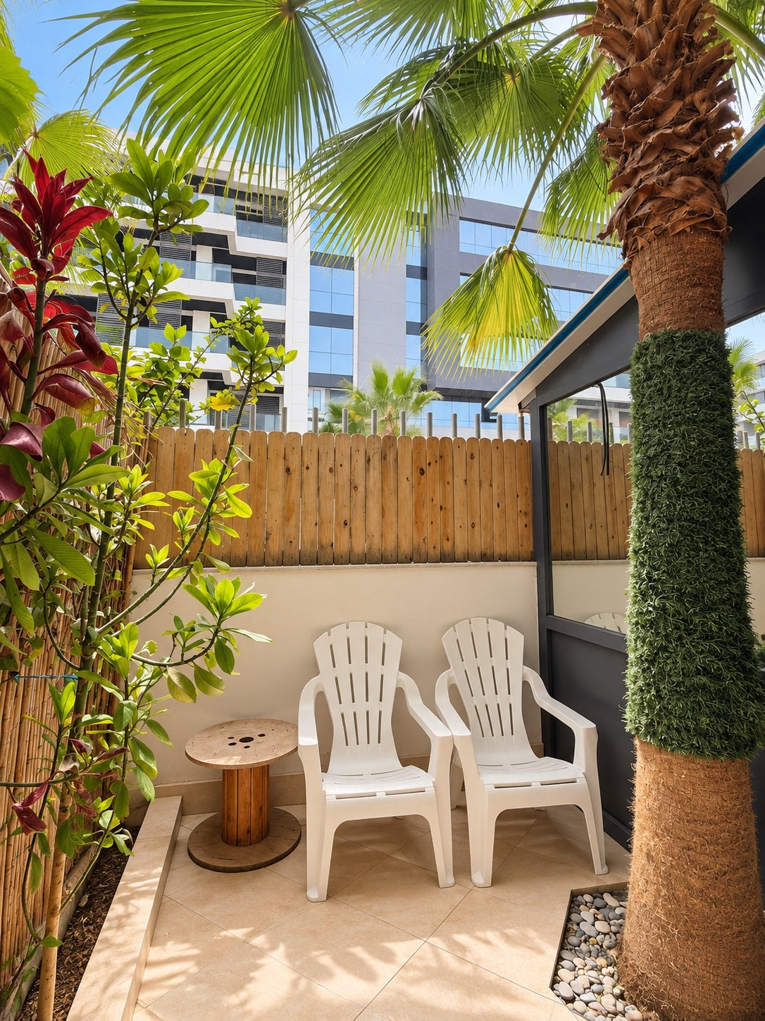 Private garden | Private garden seating under palm trees