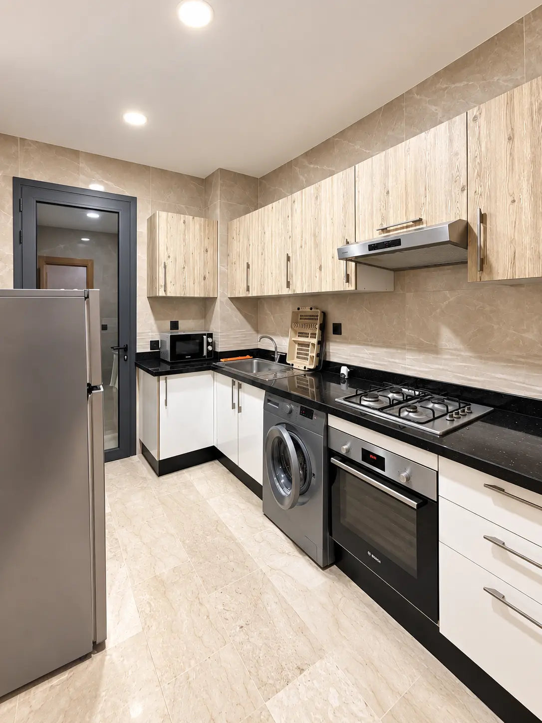 Kitchen | Fitted kitchen with appliances, washing machine, oven and storage