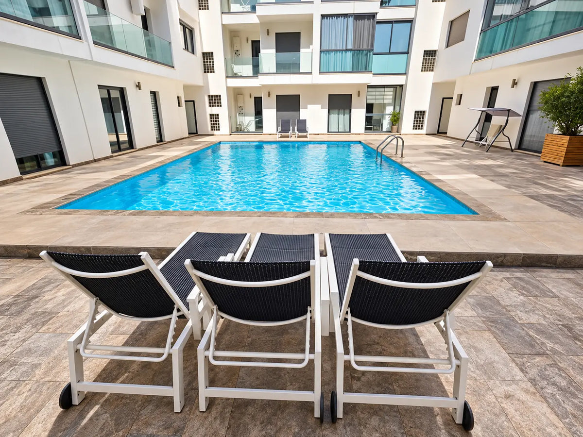Pool & residence | Pool loungers beside the Agadir Bay 3 residence swimming pool
