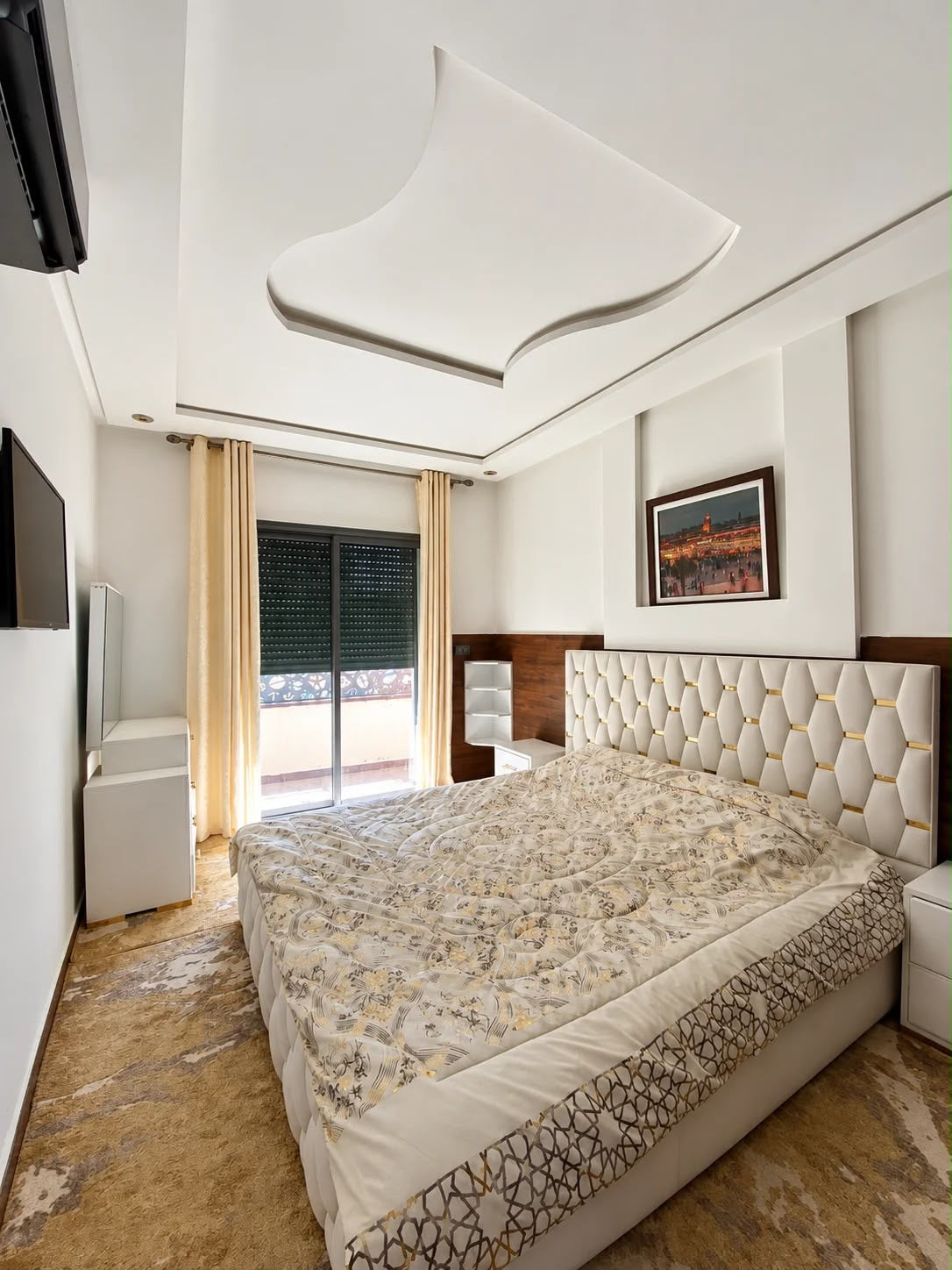Double bedroom with upholstered headboard and air conditioning