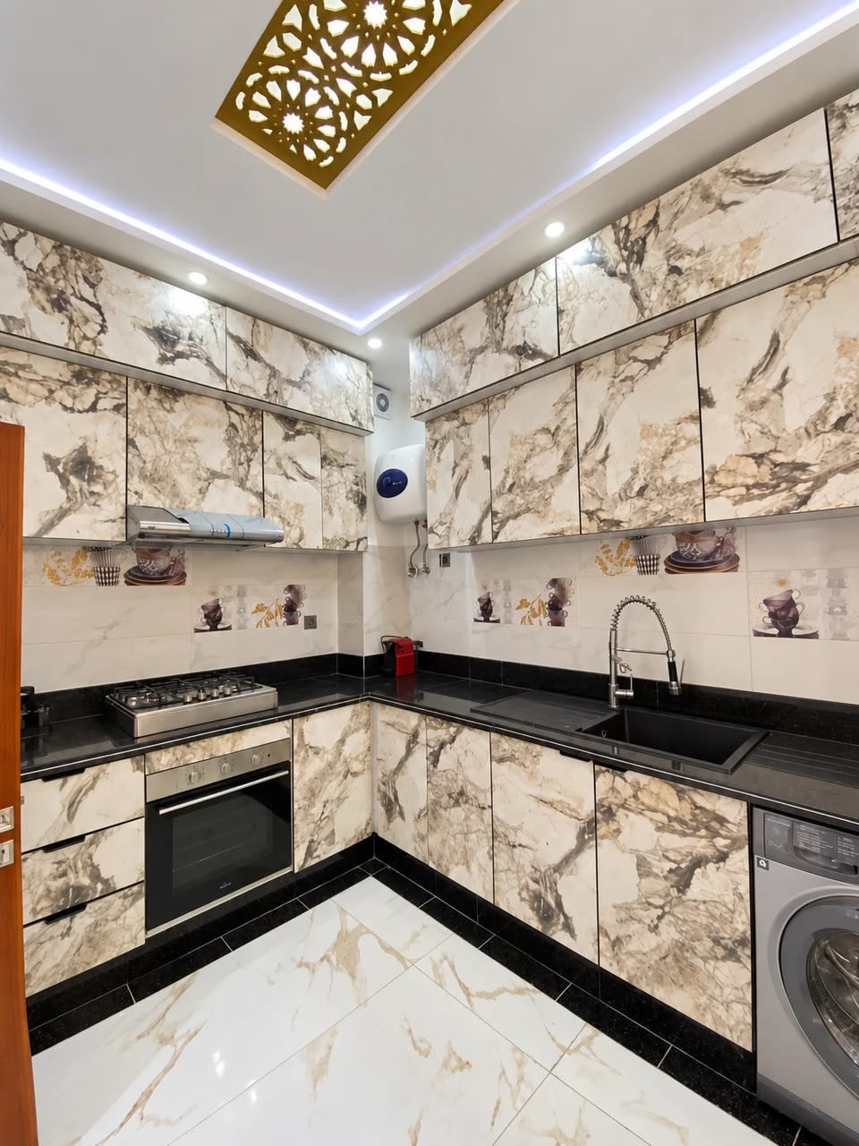 Fitted kitchen with oven, hob and washing machine