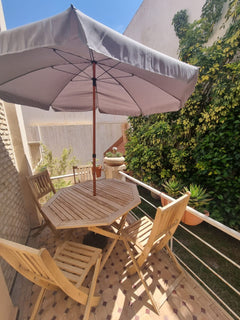 Outdoor dining table — Dakhla Bloc F1 villa, Agadir