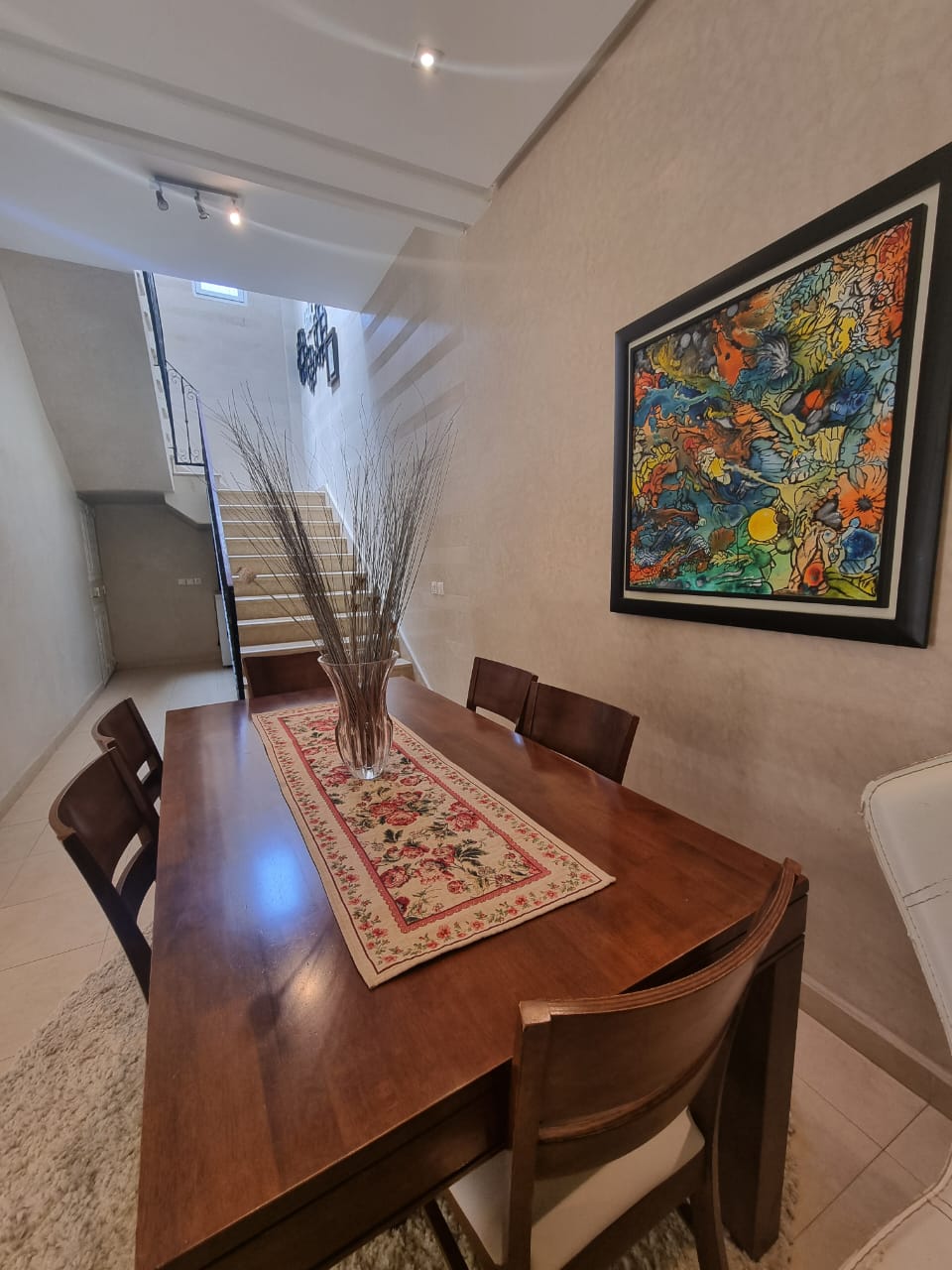Dining table and staircase — Dakhla Bloc F1 villa, Agadir