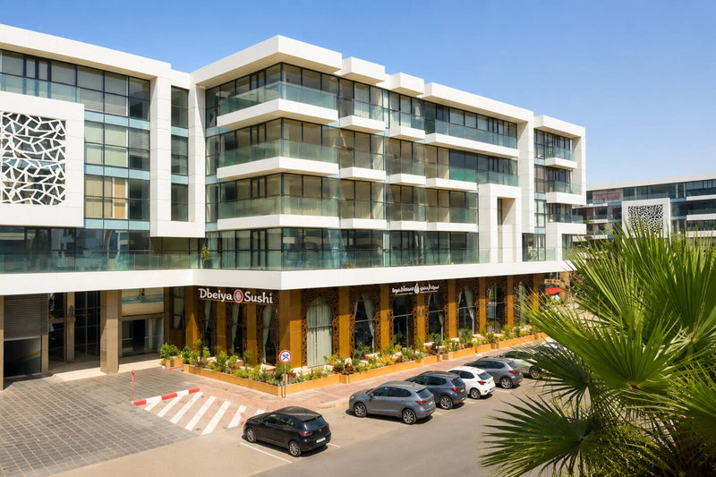 Modern buildings and palm trees in the Agadir Bay neighbourhood.