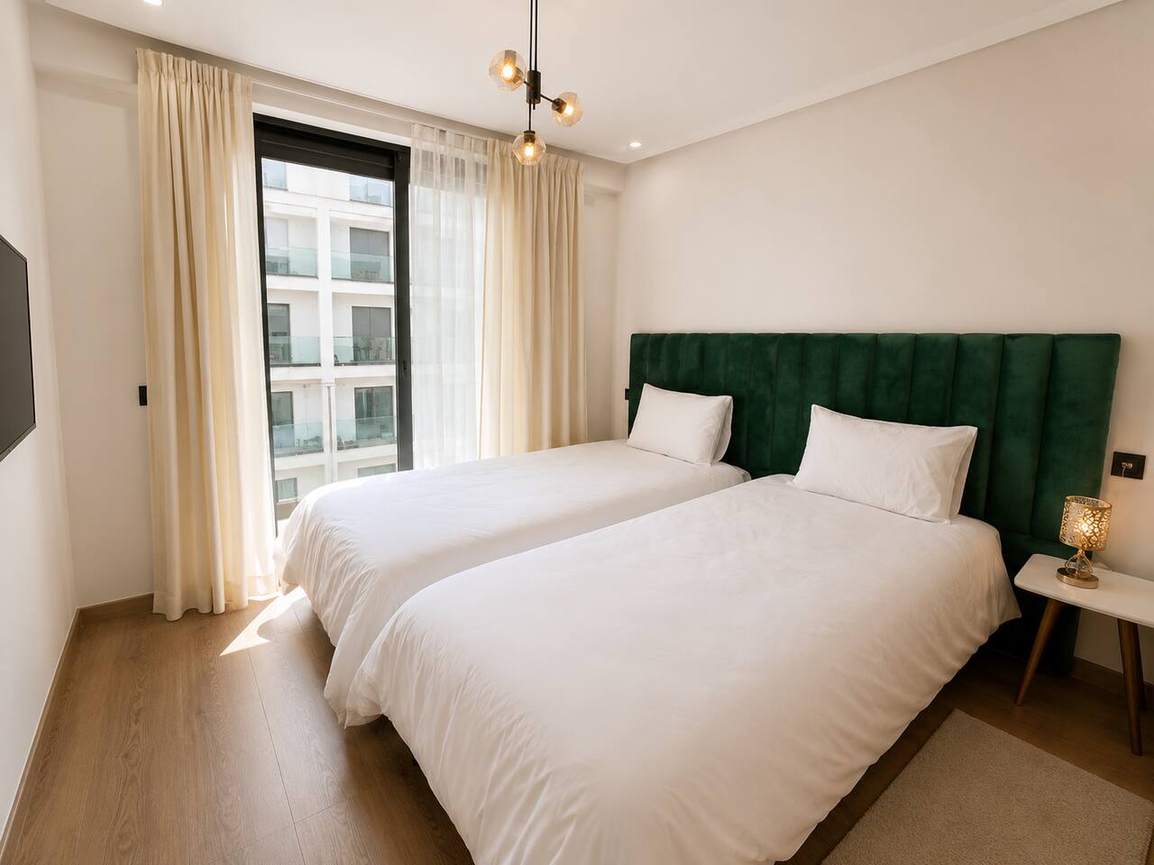 Main bedroom with large window and soft neutral bedding in Agadir Bay.