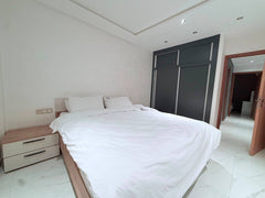 Double bedroom with fitted wardrobe in the central Agadir apartment.