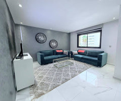 Entrance view into the spacious living room in the central Agadir apartment.
