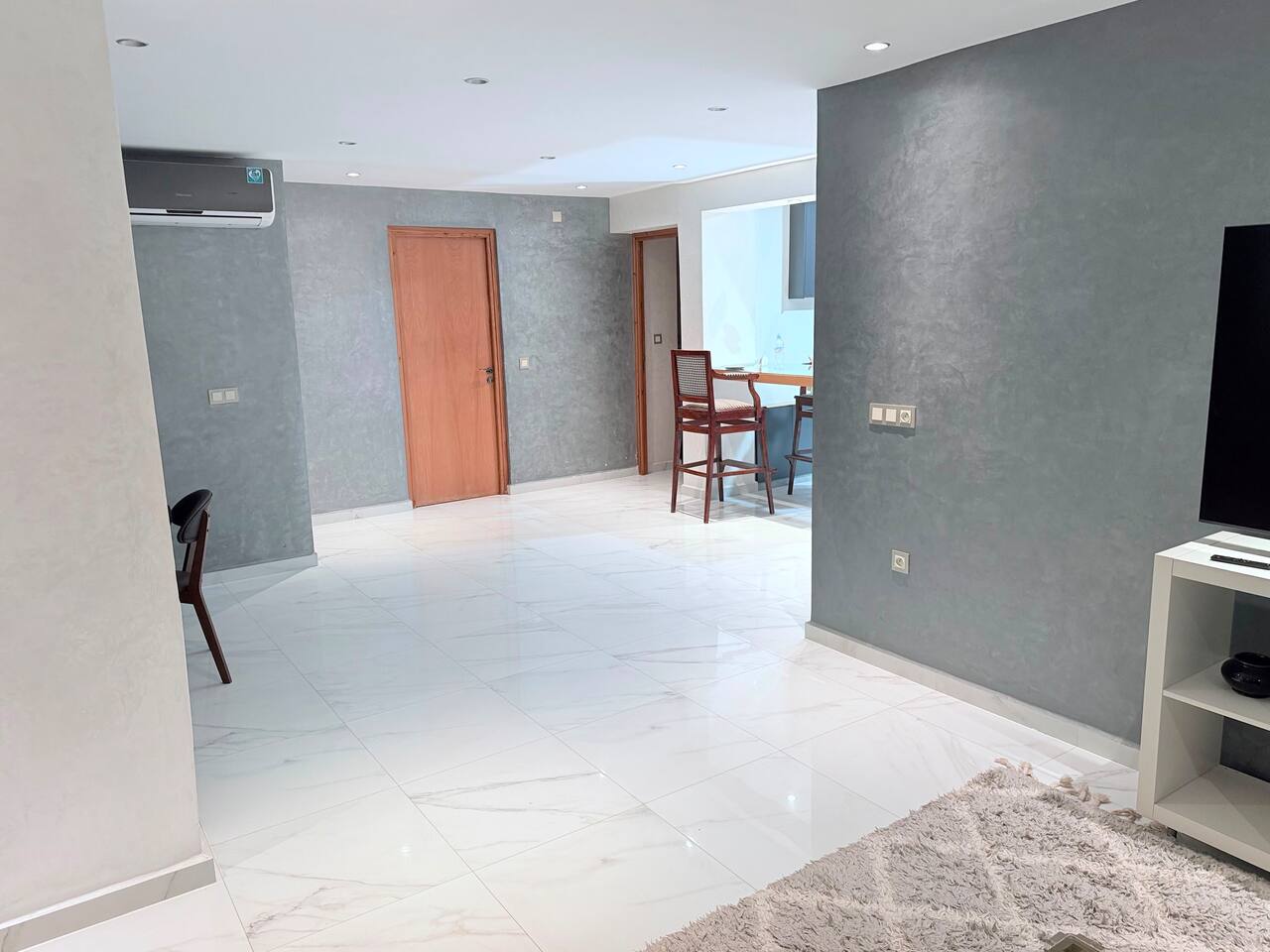 Open-plan hallway and dining area in the central Agadir apartment.