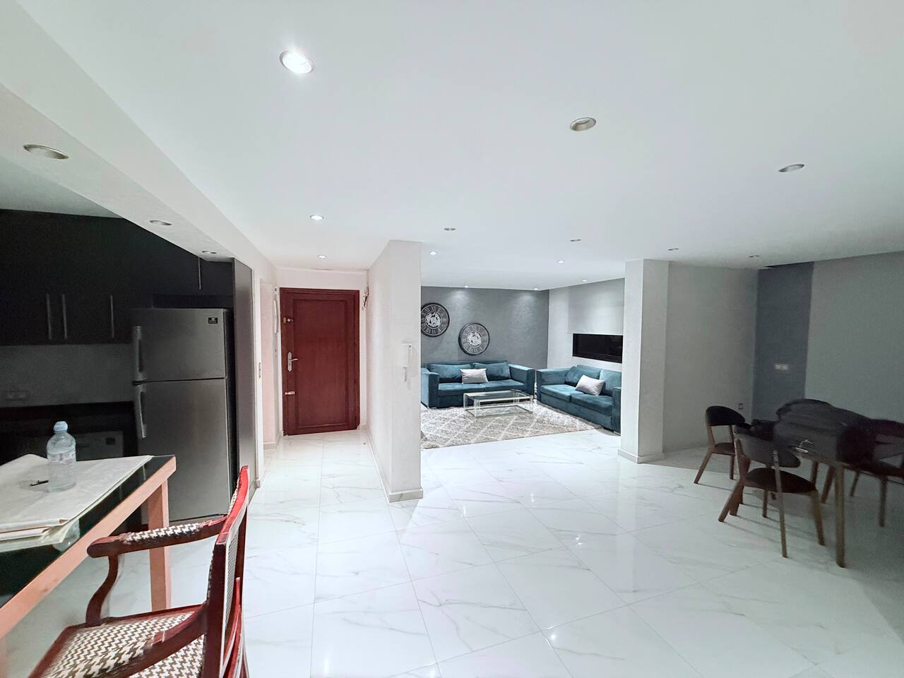 Wide open-plan living and dining area in the central Agadir apartment.