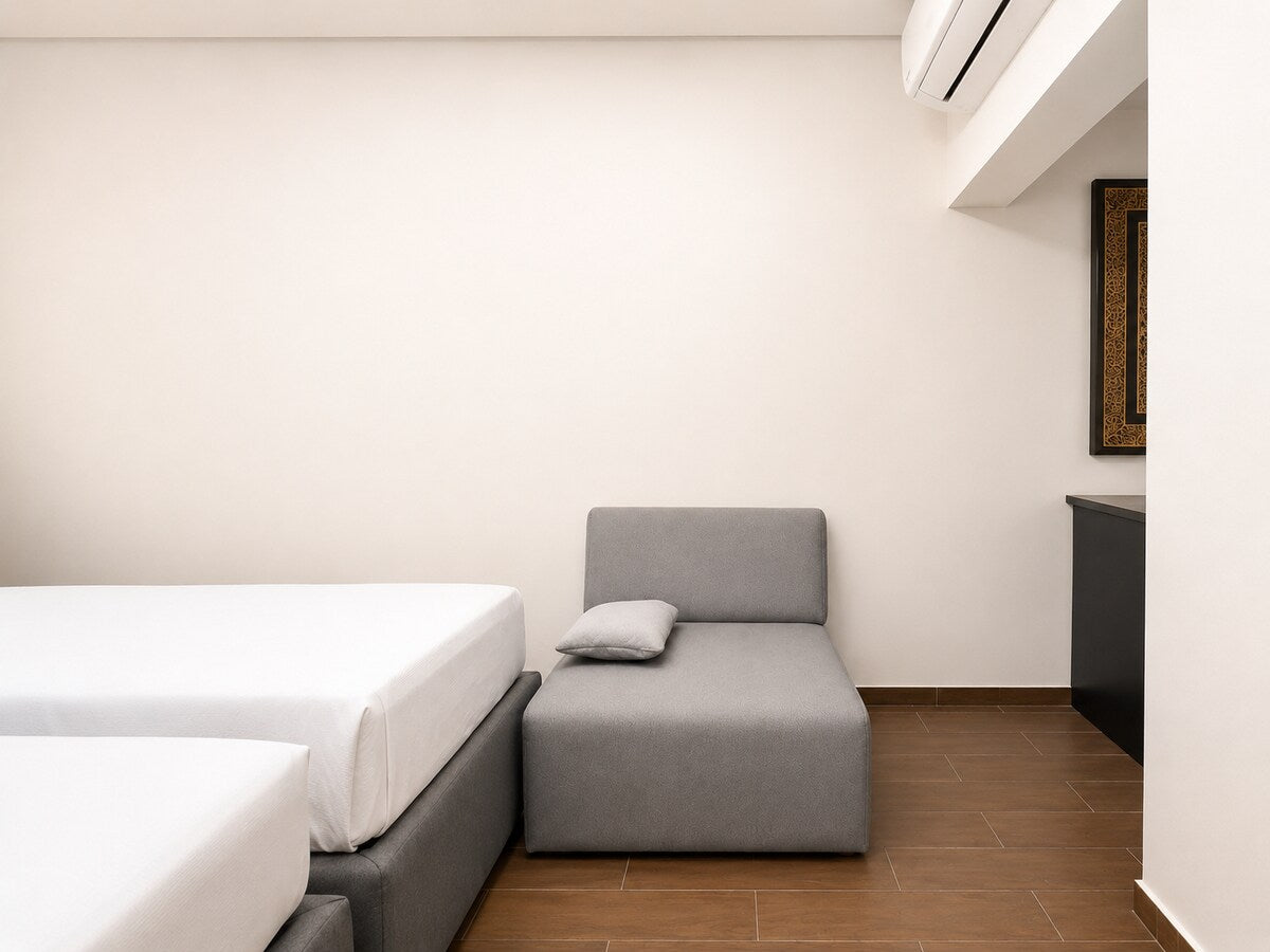 Additional seating area in the air-conditioned second bedroom at Haut Founty.