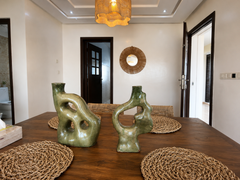 Dining table with decorative place settings in the Haut Founty apartment.