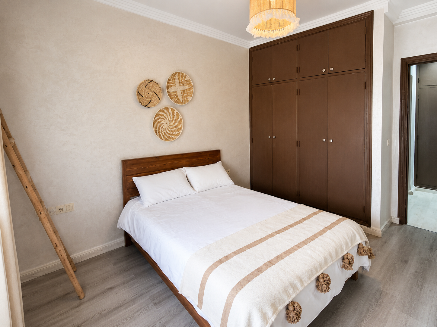 Side view of the double bedroom and wardrobe in the Haut Founty apartment.