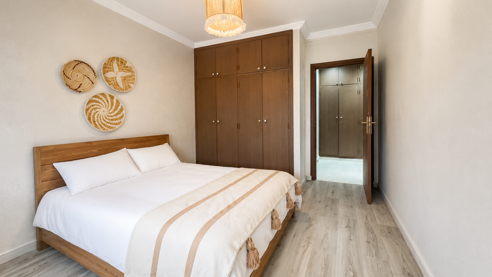 Main bedroom with fitted wardrobe in the Haut Founty apartment.