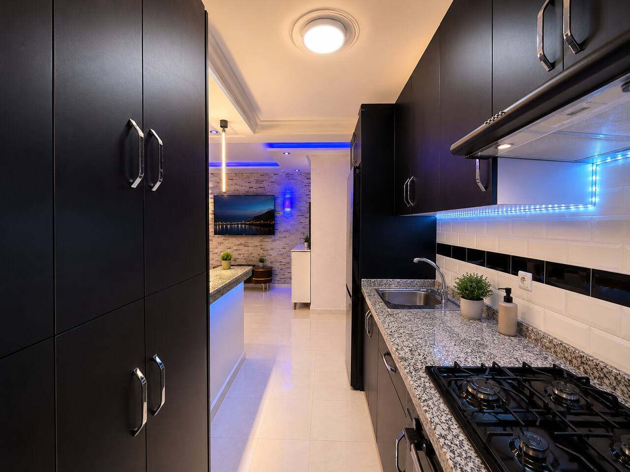 Equipped black kitchen with hob, cabinets and appliances in Hay Mohammadi.