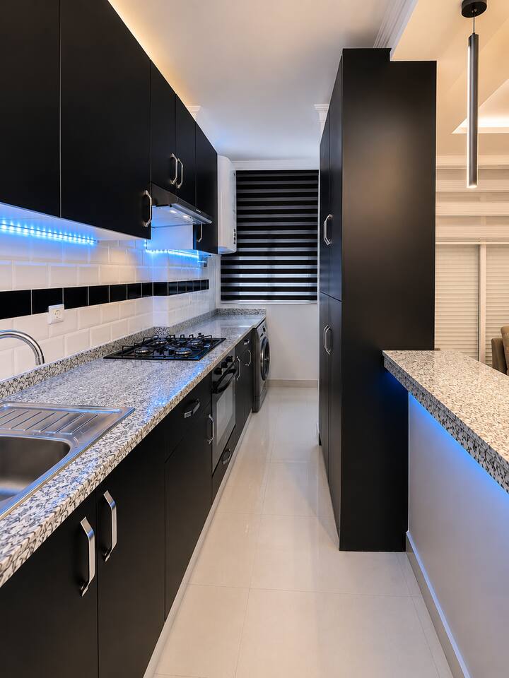 Full view through the fitted galley kitchen in the Hay Mohammadi apartment.