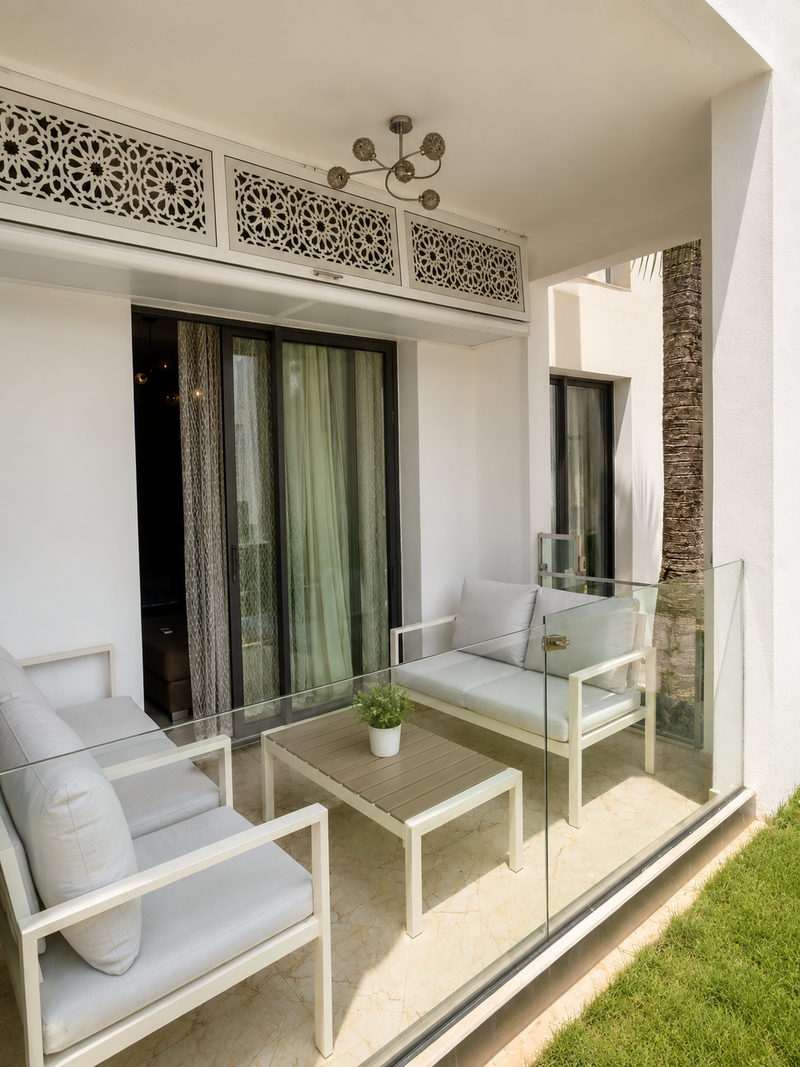 Sheltered balcony seating area at the Hivernage Agadir Bay apartment.