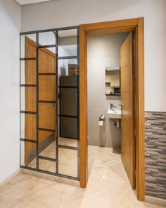 Apartment hallway with glass divider and bathroom entrance at Hivernage Agadir Bay.