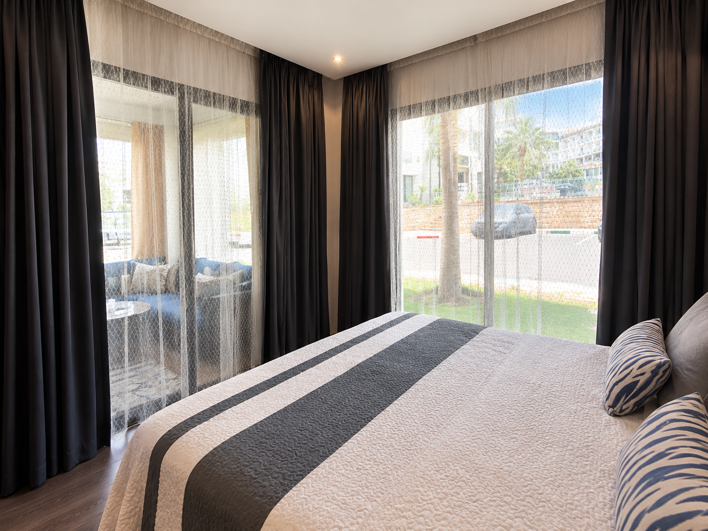 Main bedroom with direct balcony access in the Hivernage Agadir Bay apartment.