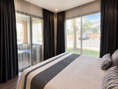 Main bedroom with direct balcony access in the Hivernage Agadir Bay apartment.
