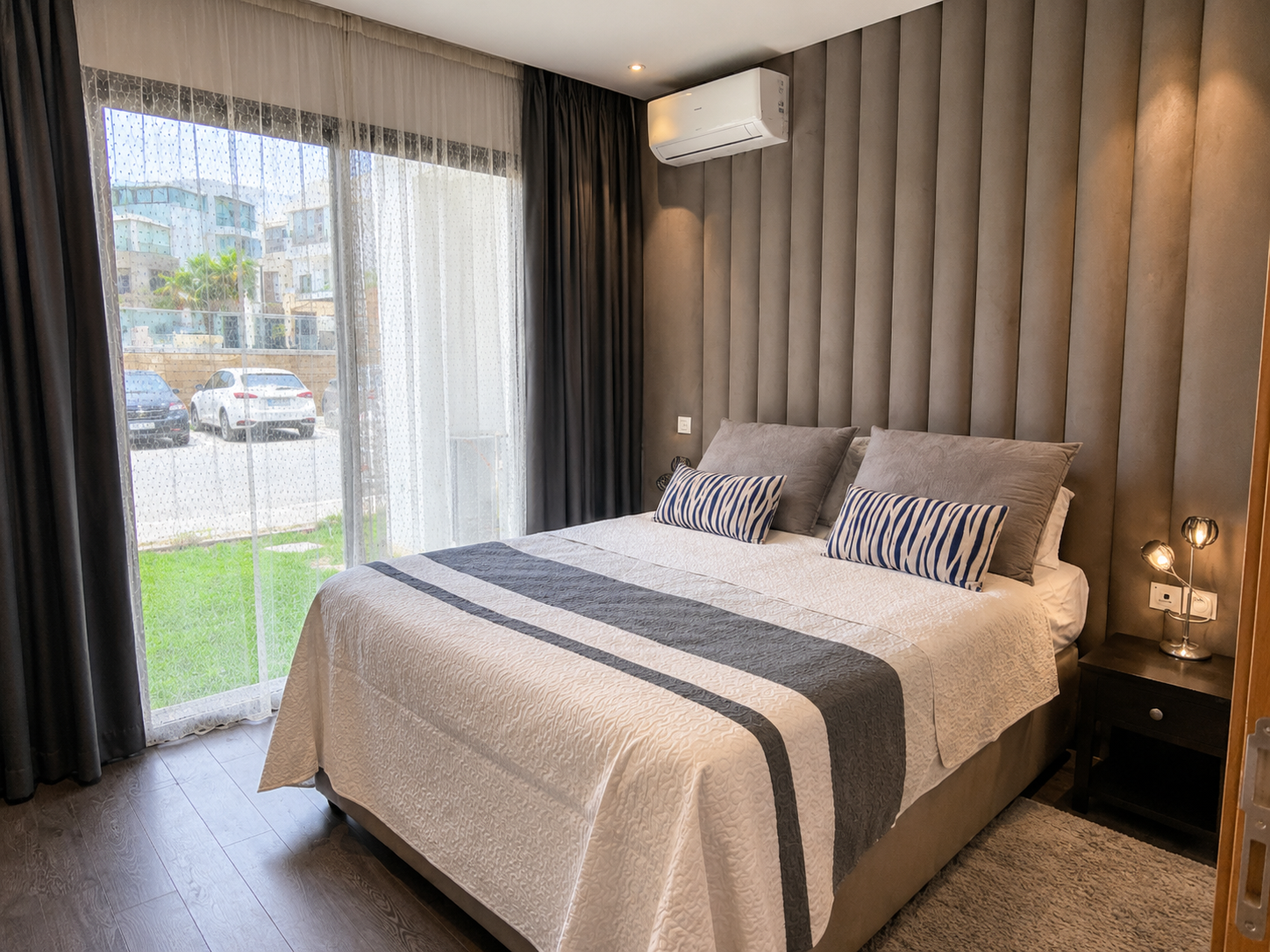 Main bedroom overlooking the residence gardens at the Hivernage apartment.