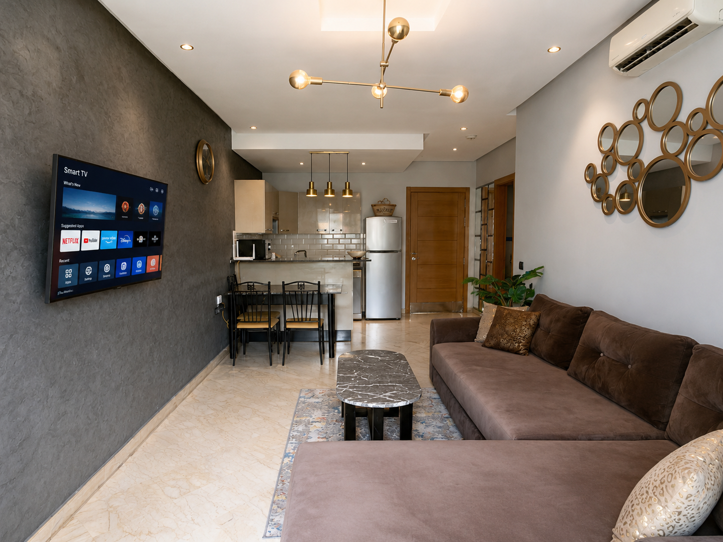 Open-plan living and dining room in the Hivernage Agadir Bay apartment.
