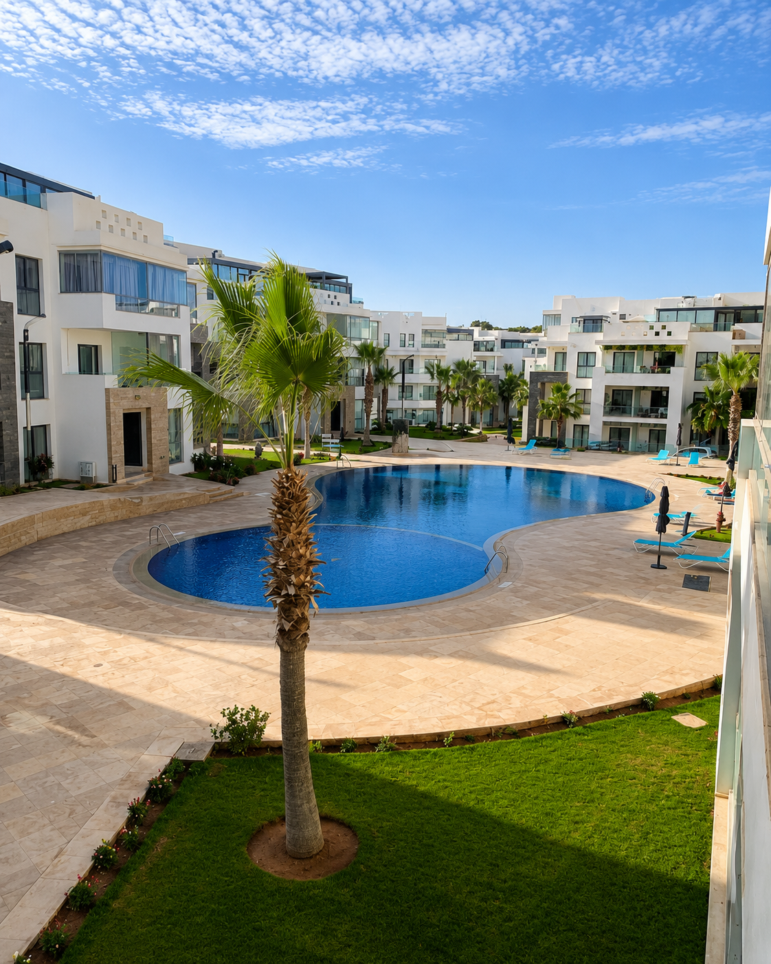 Wide view of the communal pool courtyard at Hivernage Agadir Bay in Agadir.