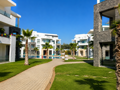 Landscaped walkway through Hivernage Agadir Bay residence gardens in Agadir.