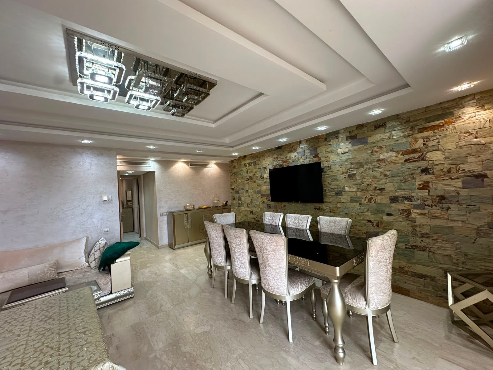 Elegant living and dining area at the Iken Gardens apartment in Agadir Bay.