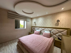 Wide view of the main double bedroom overlooking greenery at Iken Gardens, Agadir Bay.