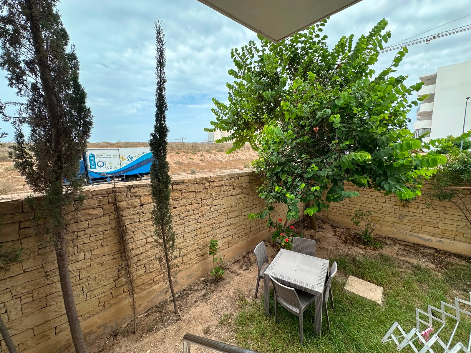 Private ground-floor garden with outdoor dining table at Iken Gardens in Agadir Bay.