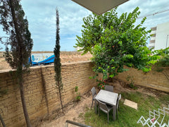 Private ground-floor garden with outdoor dining table at Iken Gardens in Agadir Bay.
