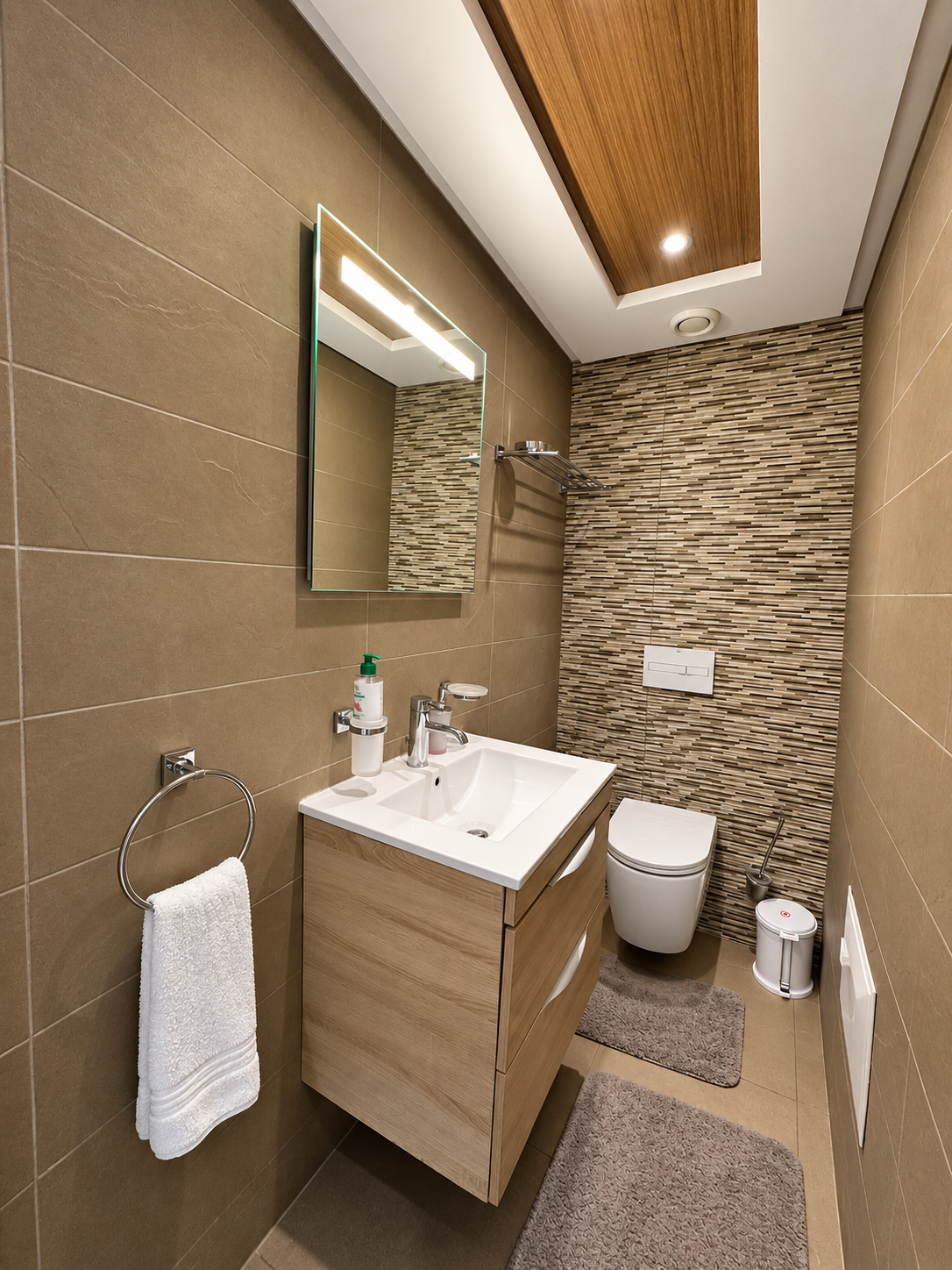Second bathroom with vanity, toilet and wood-effect ceiling.