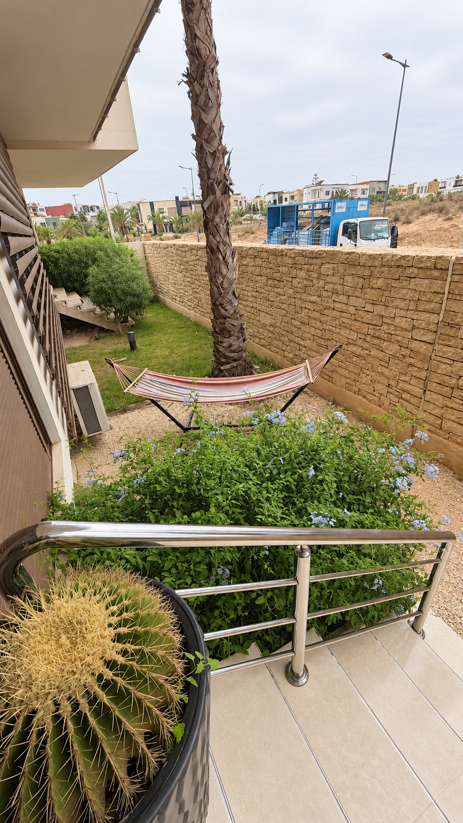 Hammock and planted border in the private garden.