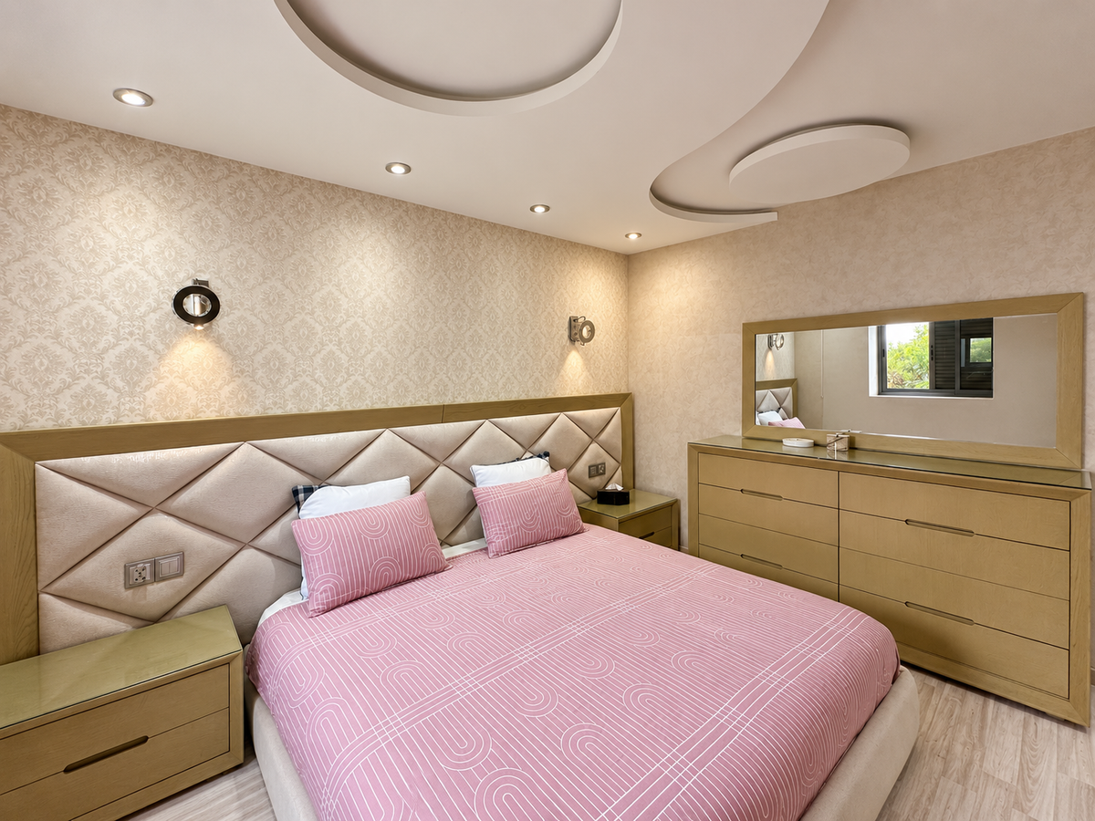 Bedroom with mirrored wardrobe at the Iken Gardens holiday apartment, Agadir Bay
