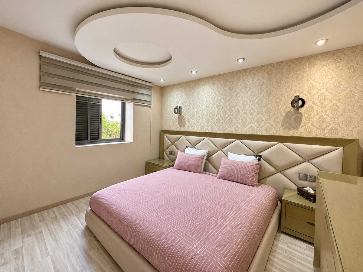 Bedroom with pink bedding at the Iken Gardens holiday apartment, Agadir Bay