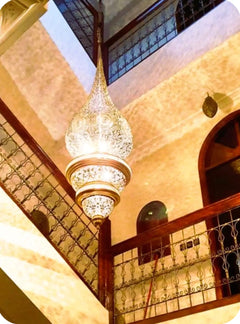 Decorative pendant light and upper gallery inside the Marrakech riad