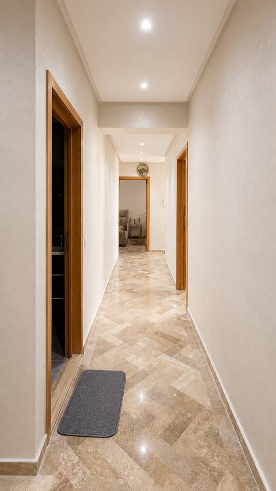Hallway leading towards the bedrooms in the apartment near Agadir Bay.
