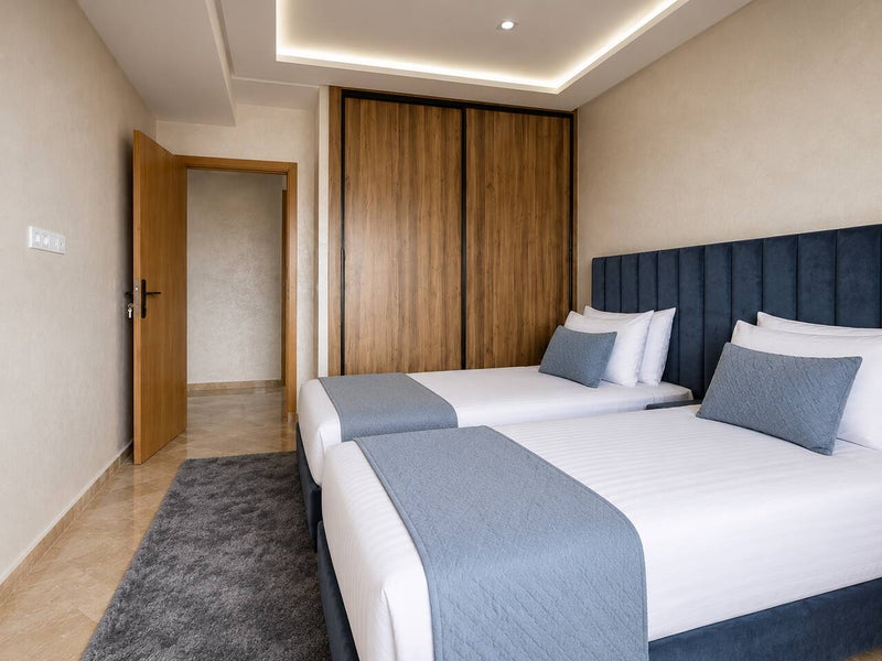 Twin bedroom viewed from the doorway in the premium apartment near Agadir Bay.
