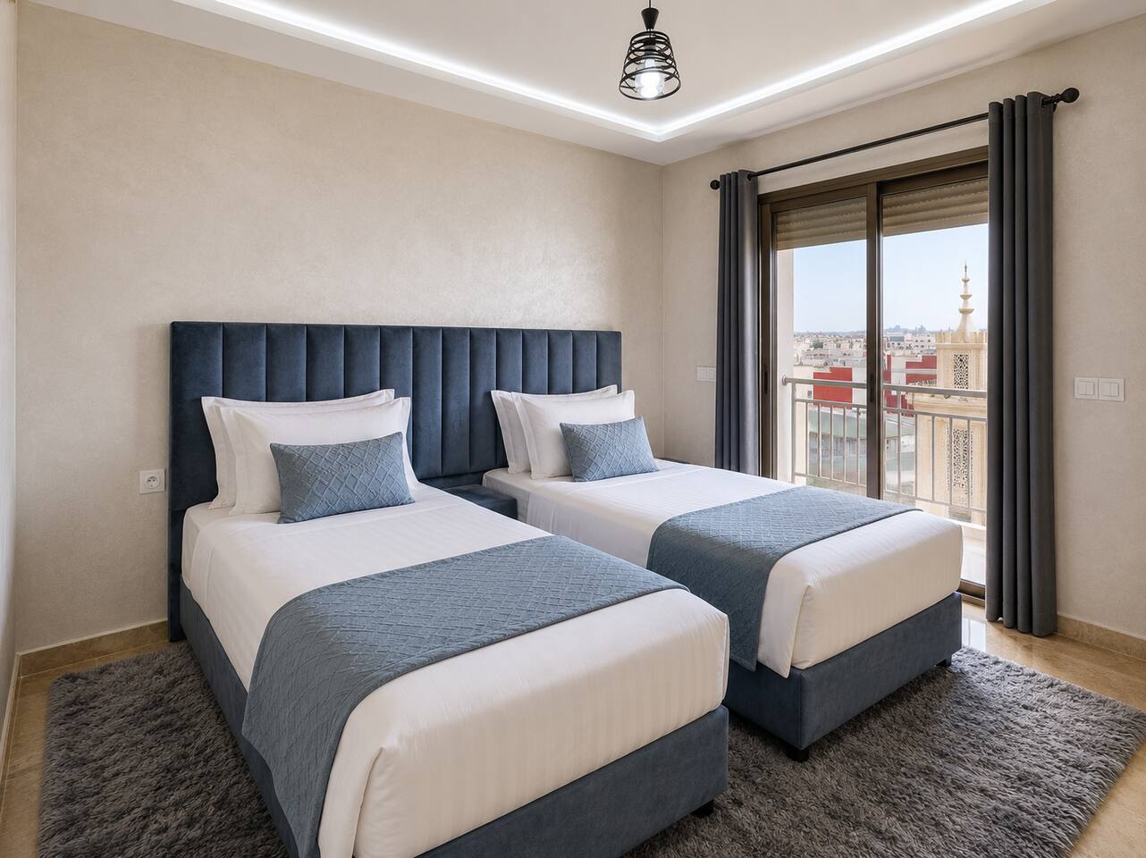 Wide view of the twin bedroom with window in the apartment near Agadir Bay.