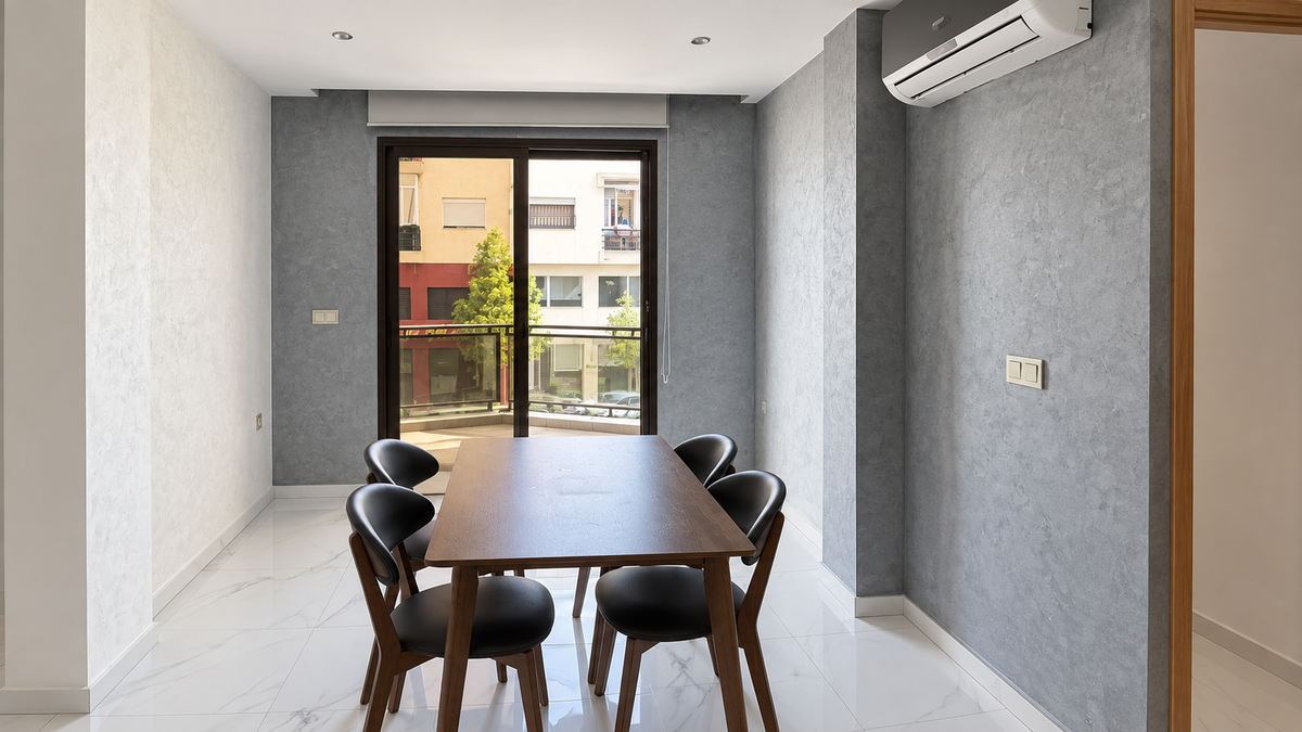 Dining table and kitchen at the Central Agadir holiday apartment near the beach and souk