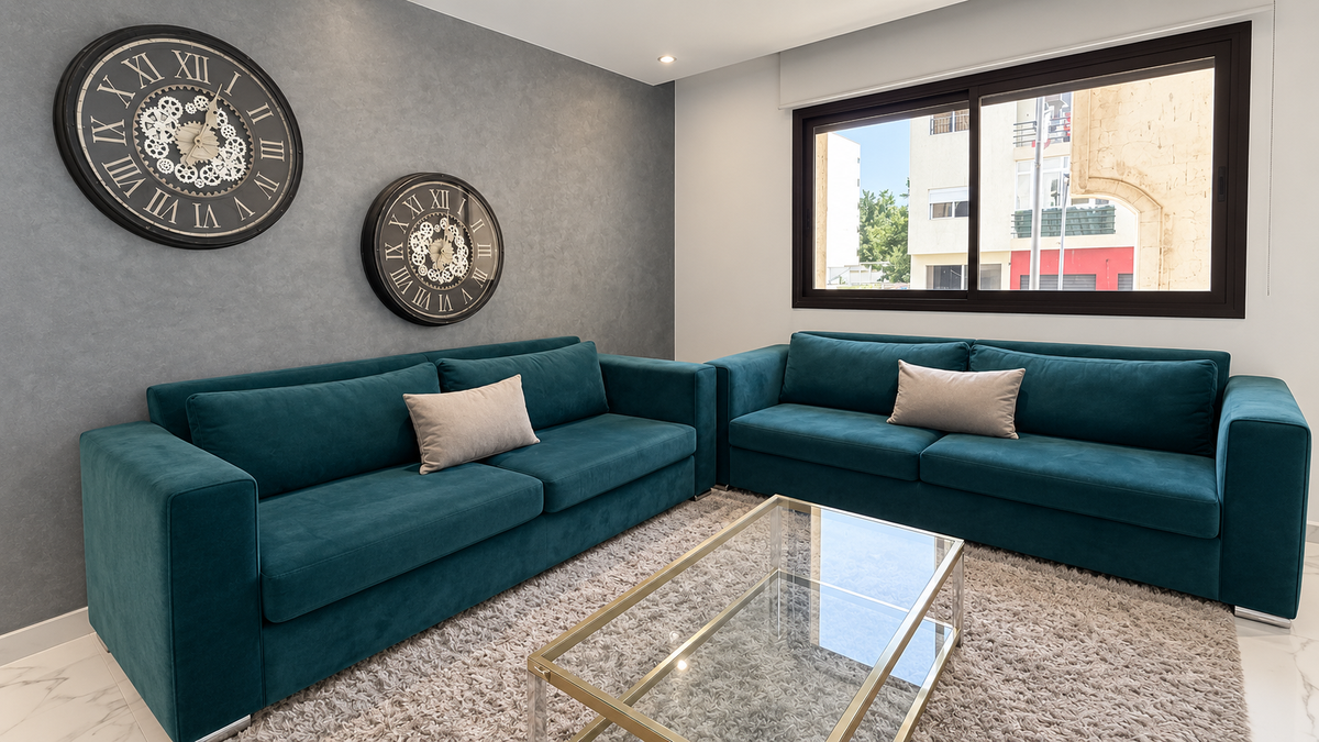Teal corner sofa and glass coffee table at the Central Agadir holiday apartment near the beach and souk