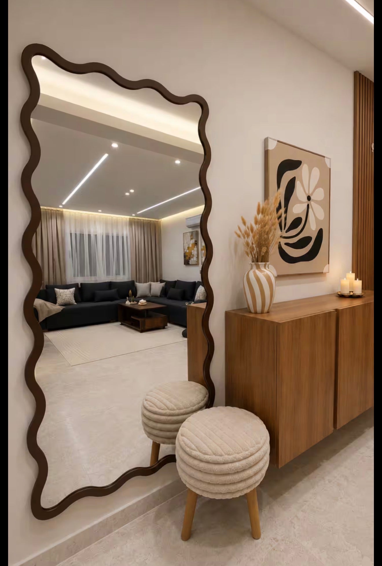 Bedroom mirror and dresser area in DHAJIA Tilila, Agadir apartment with refined interior details.